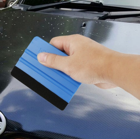 Automotive film scraper